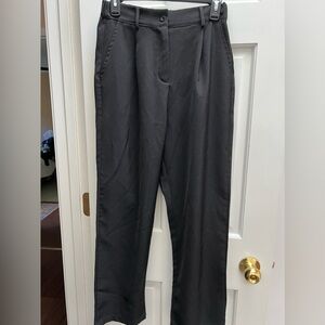 Black slacks with front pleats